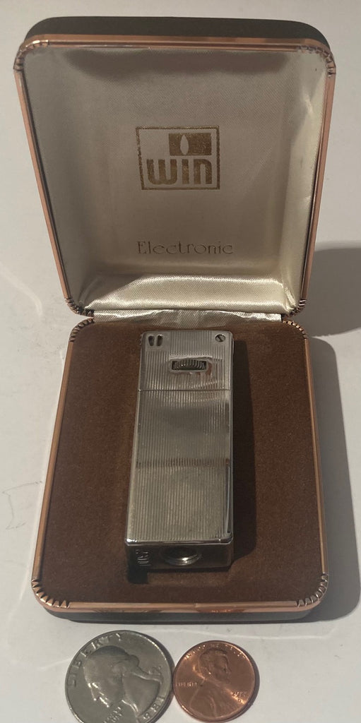 Vintage Metal Lighter, WIN, Nice Striped Design, Heavy Duty, Cigarettes, Cigars, Smoking, More.  This lighter does not light up when I play with it, I did not try it any more than that, but most all lighters work with either a new flint, wick, or fuel.